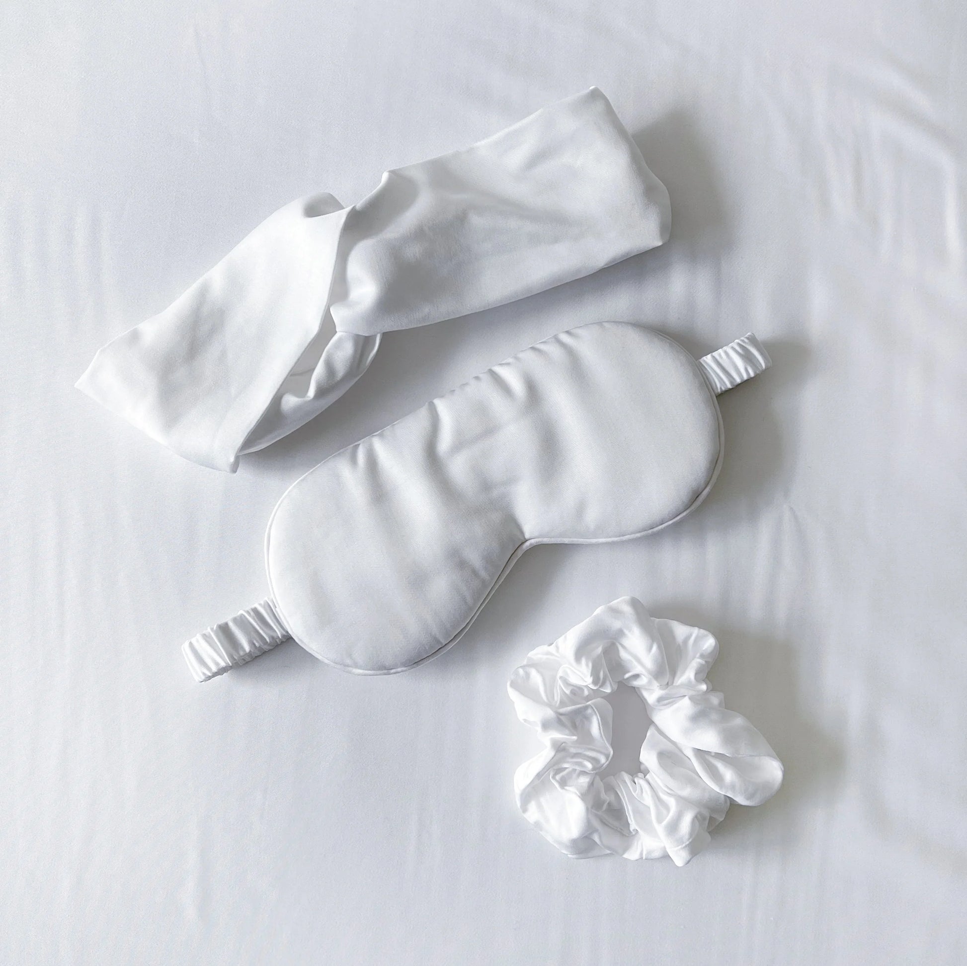 Bamboo sleep care set with white eye mask, white headband, matching scrunchie