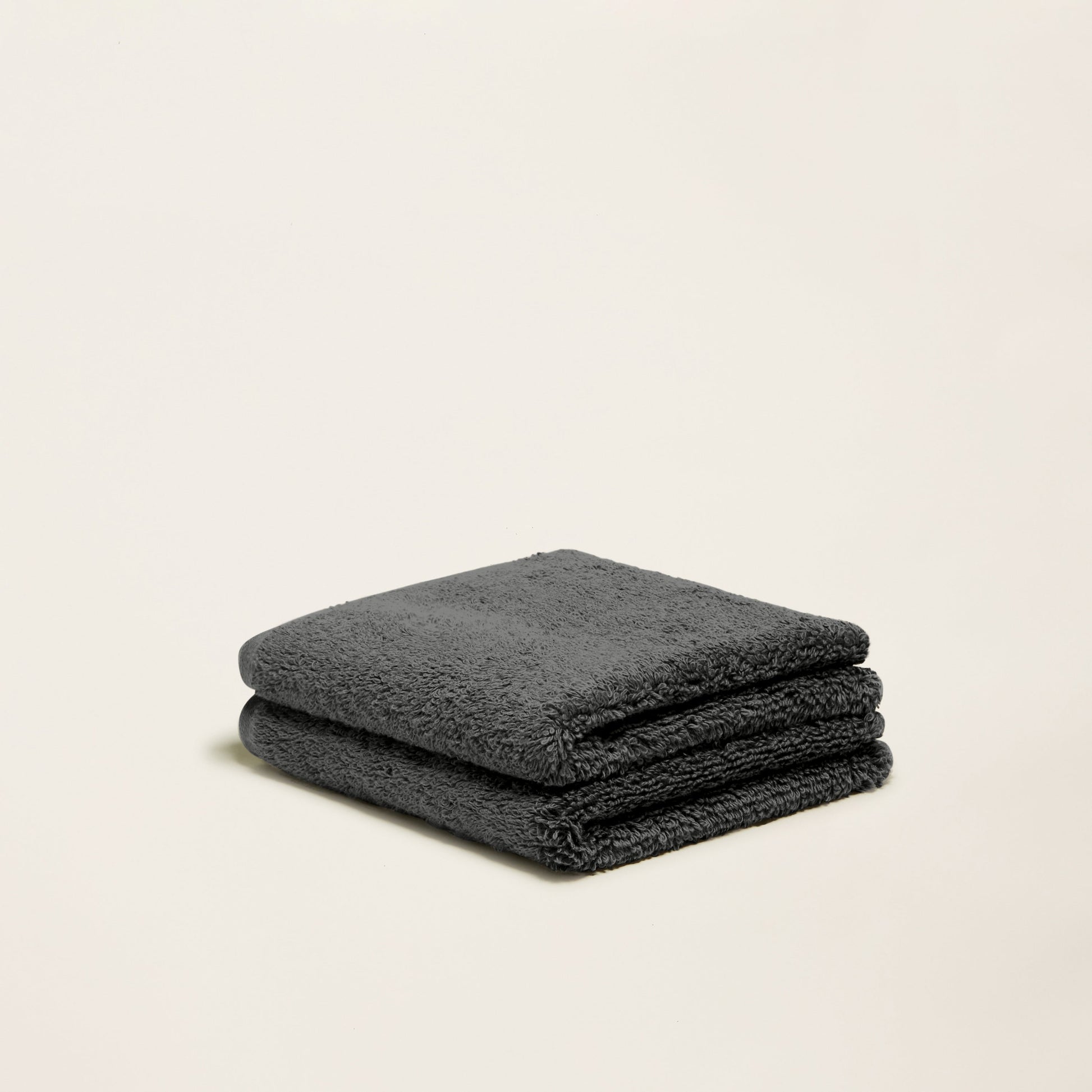 Charcoal terry cotton towel, two folded layers with plush, looped texture