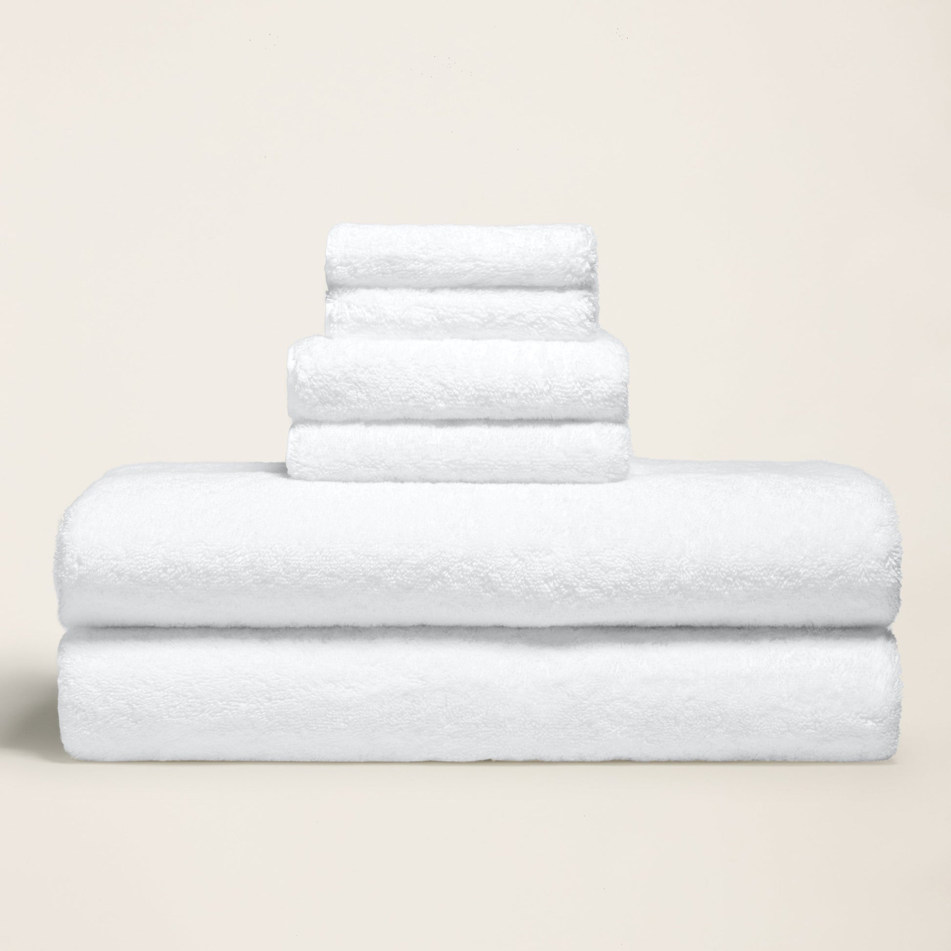 White terry cotton towels, three folded layers with plush looped texture