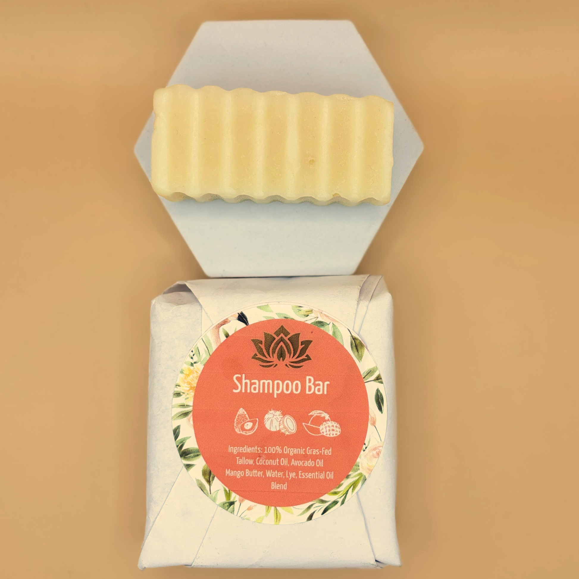 Shampoo bar package with round label and pale yellow tallow bar on top