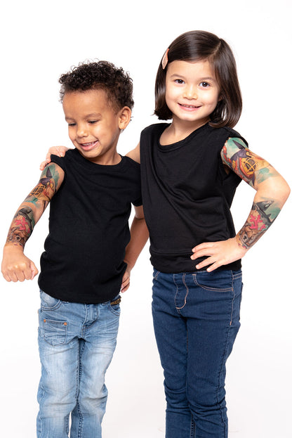 Temporary kids tattoo sleeve on two children’s arms, colorful shark-attack artwork