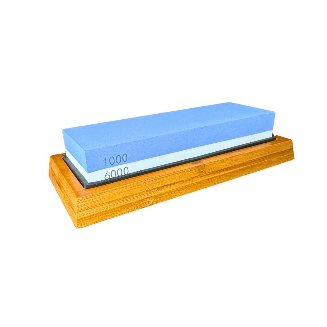 Sharpening stone with blue 1000/6000 grit face on wooden base