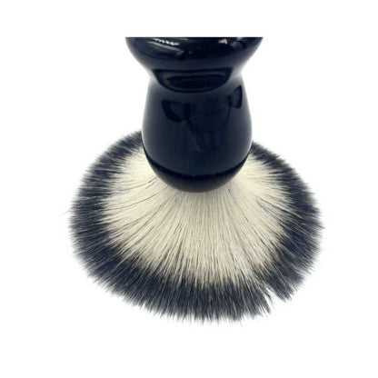 Shaving brush with black handle and dense grey bristles, round head