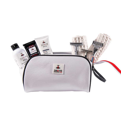 Men's grooming kit zip pouch with shaving tools, creams, and blade cartridges