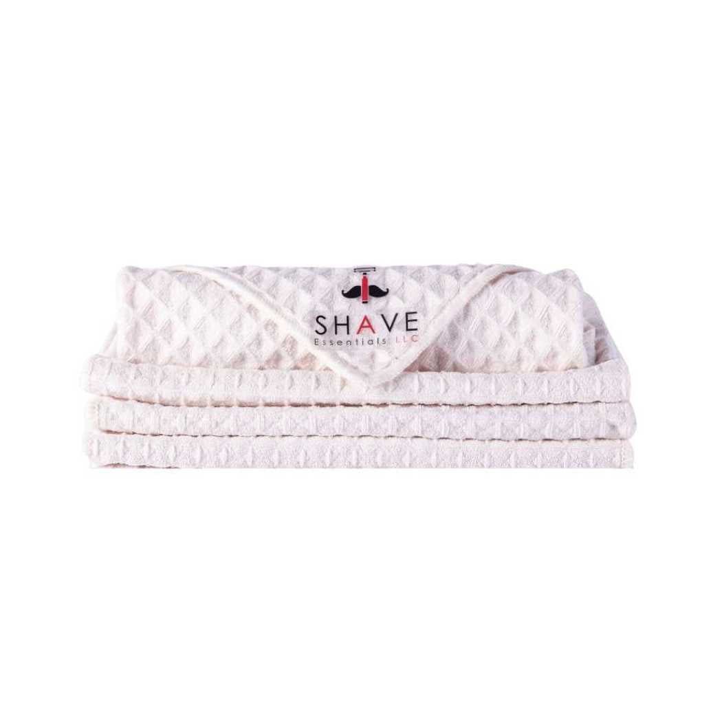 Shave towels stack, light pink waffle-knit with SHAVE logo