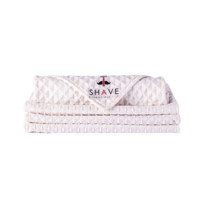 Shave towels stack, light pink waffle-knit with SHAVE logo