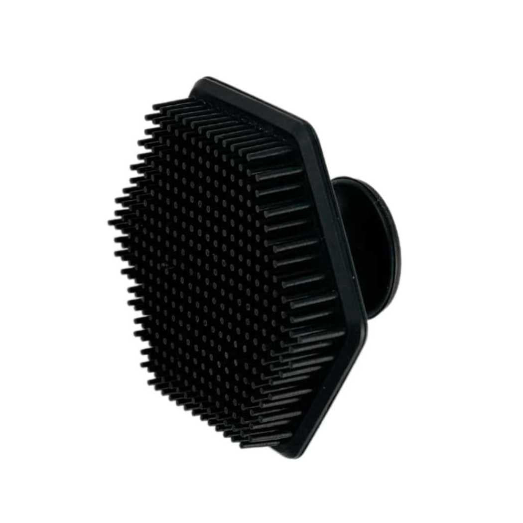 Black silicone face scrubber with short massage bristles and suction handle loop