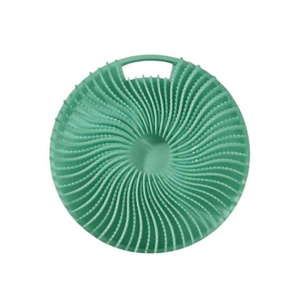 Green silicone shower scrub pad with circular ridges and top handle loop