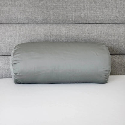 Light gray bolster pillowcase, cylindrical cover with gathered end seam.