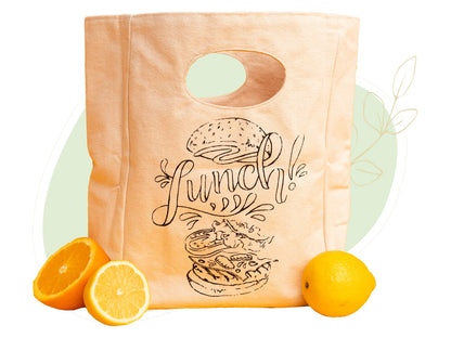 Canvas lunch bag front view with oval cutout handle and “Lunch!” printed graphic