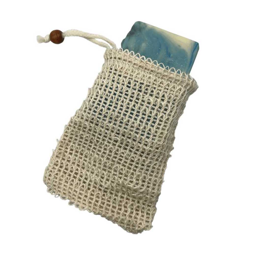 Soap saver bag, beige mesh pouch with drawstring, holding a blue soap bar