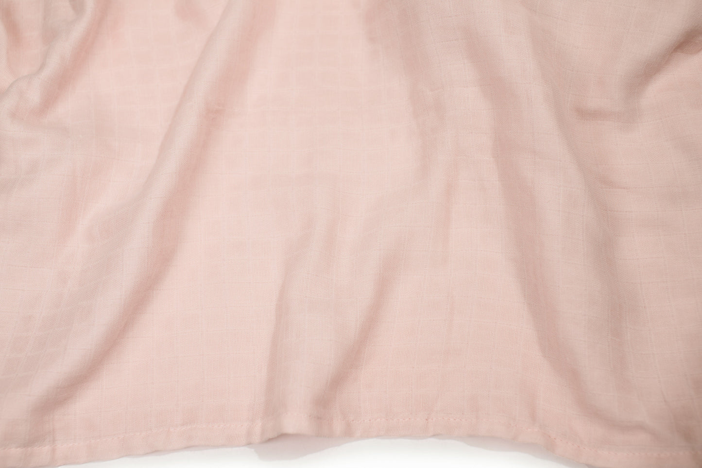 Pink swaddle blanket fabric, smooth with subtle texture