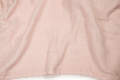 Pink swaddle blanket fabric, smooth with subtle texture