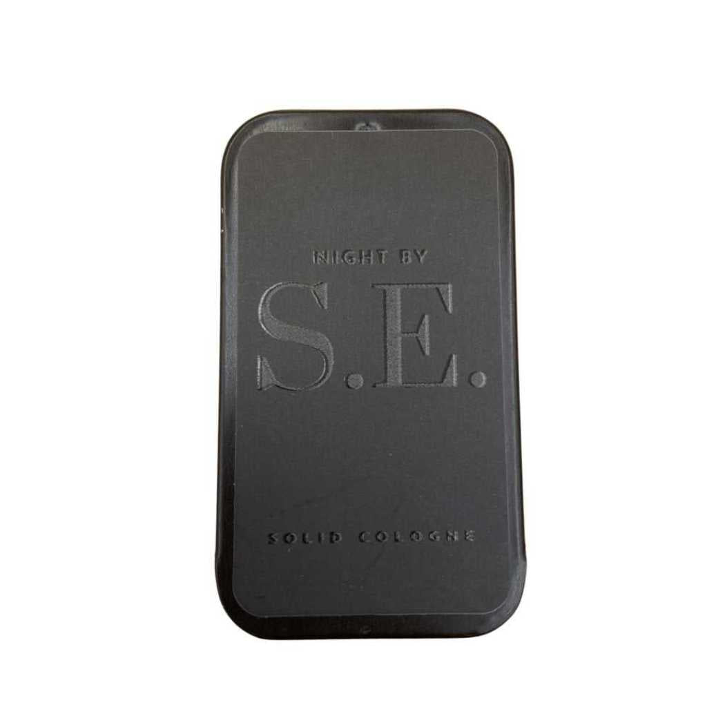 Night by S.E. solid cologne tin, dark case with large S.E. logo