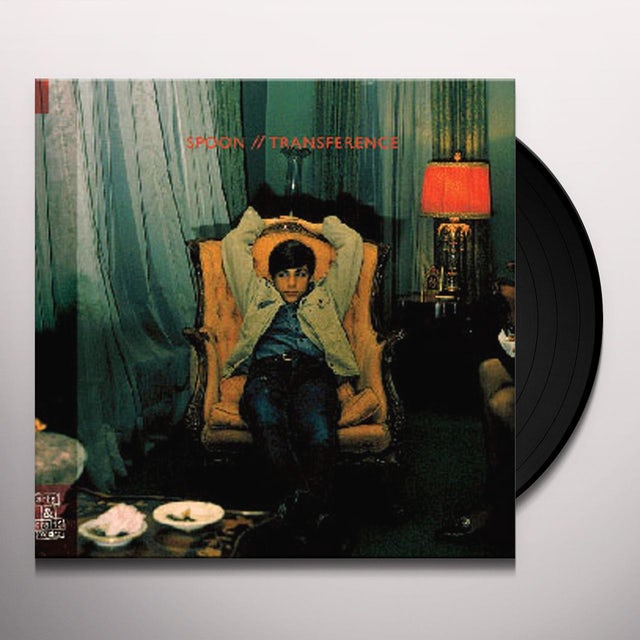 Vinyl record and album sleeve with green drape scene and red title text