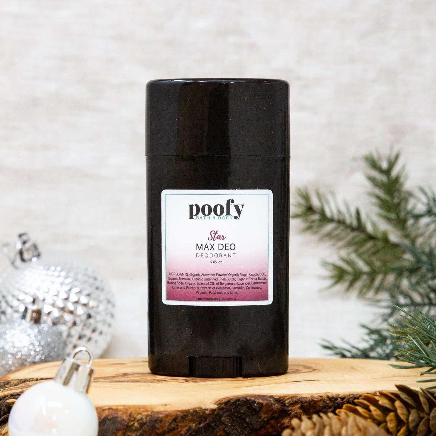 Black deodorant stick with Poofy Star Max Deo label