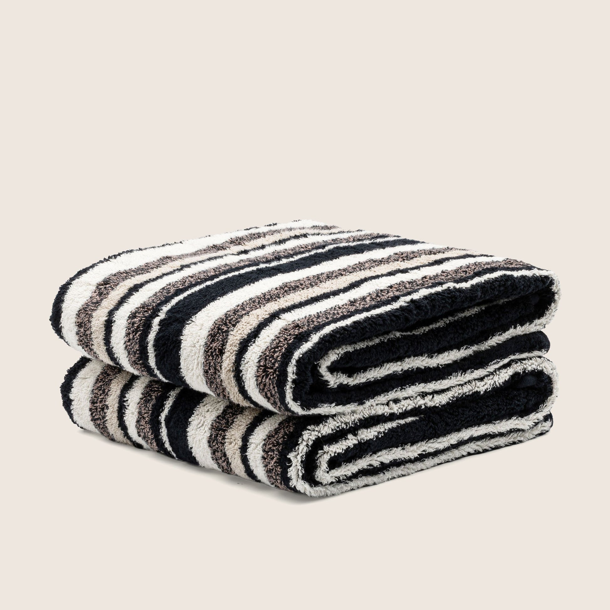 Striped cotton towel set, navy and cream rows, neatly stacked