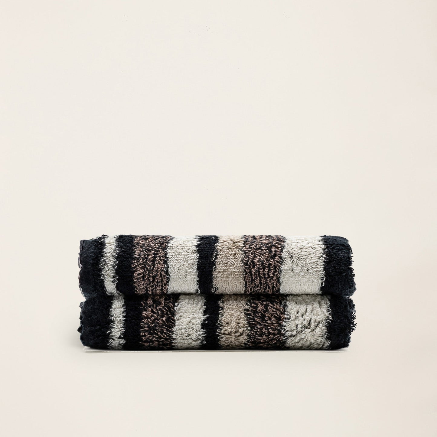 Striped cotton towel set, dark and cream with looped plush texture