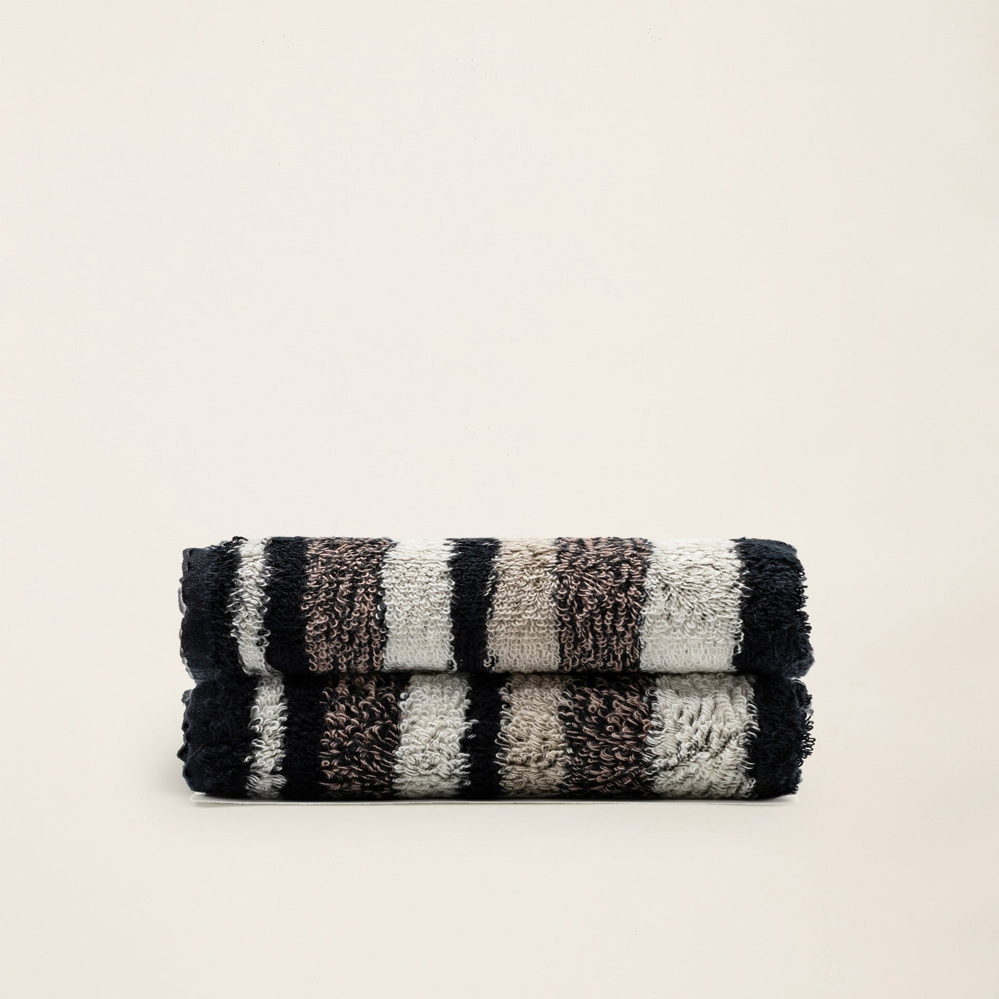 Striped cotton towel set, dark and cream with looped plush texture