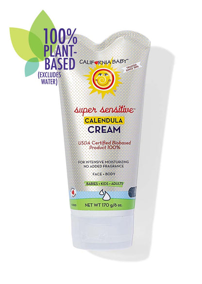 Calendula cream tube with white dotted pattern and green text band, face and body