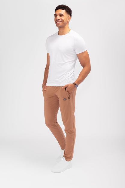 Rust-brown tapered athletic sweatpants with elastic waistband and drawstring hem