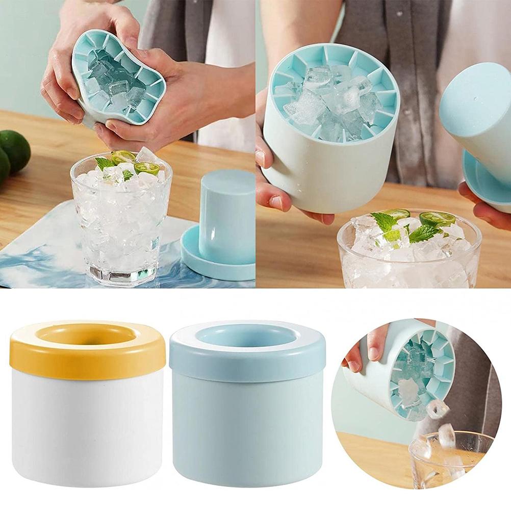 Blue silicone cylinder ice maker bucket with removable ice tray held in hands