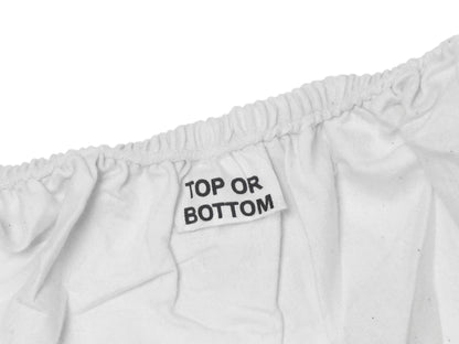 Organic percale bed sheet set, white fitted sheet edge with 'TOP OR BOTTOM' label