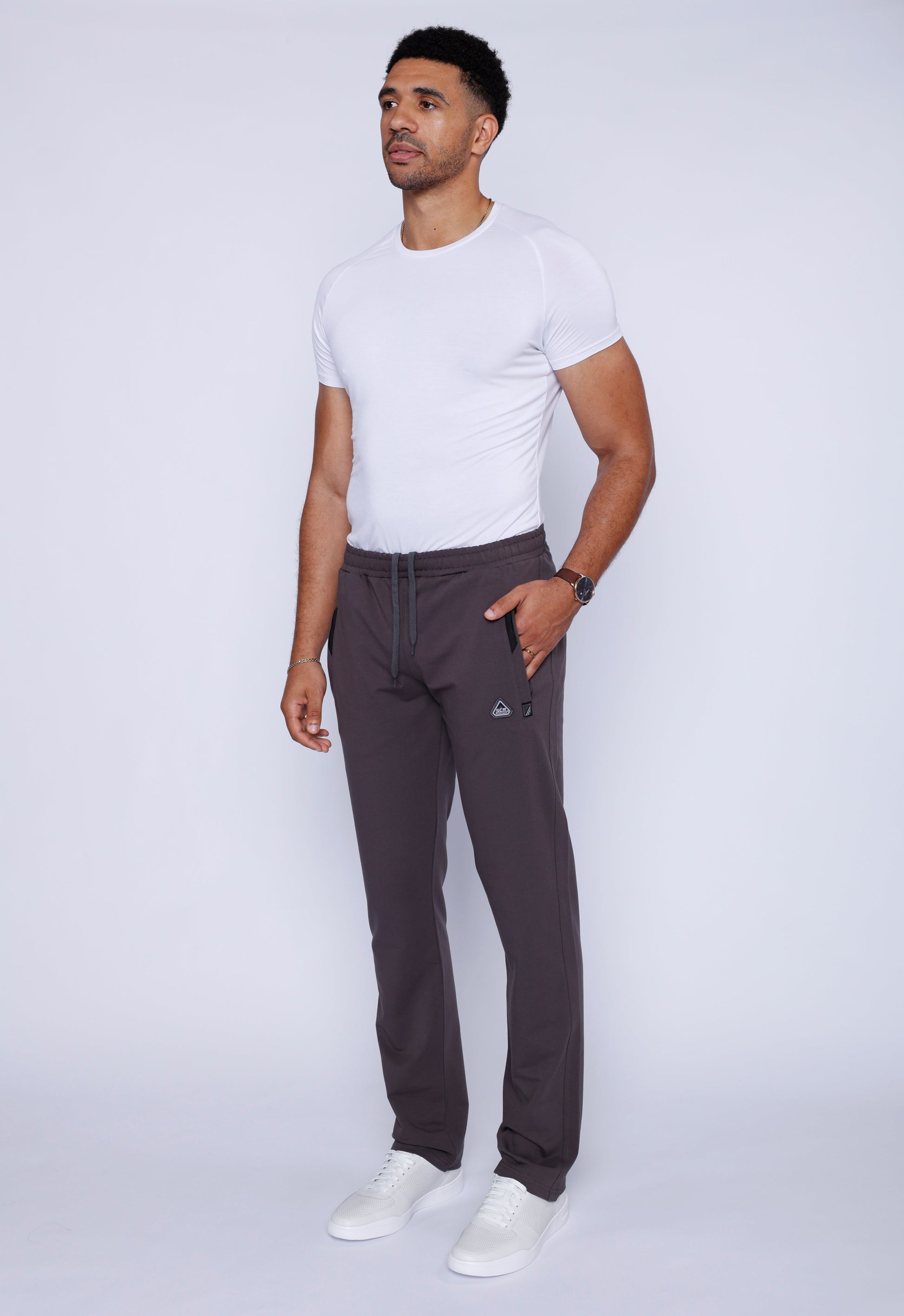 Dark grey athletic straight sweatpants with drawstring waistband and side pockets