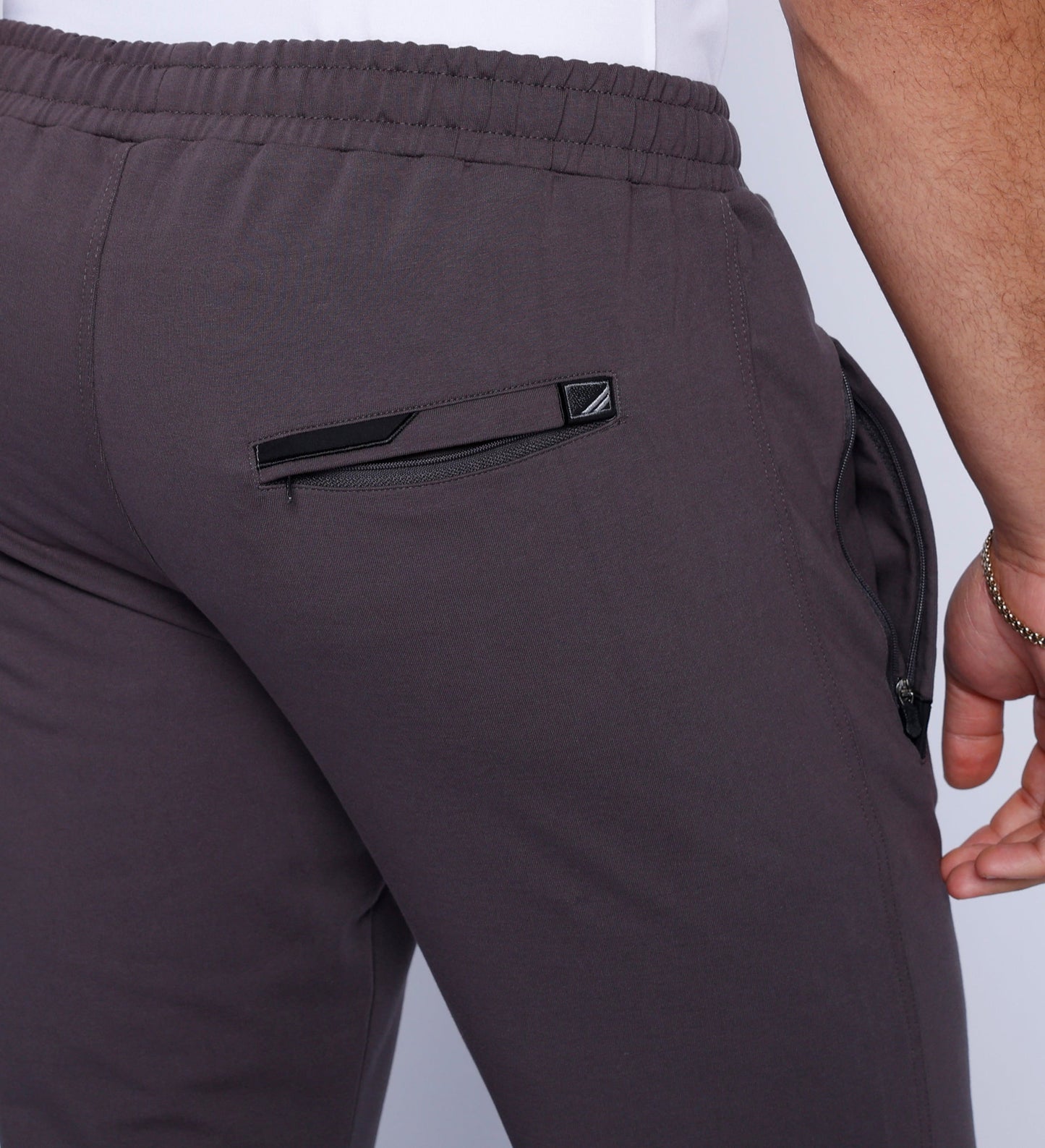 Men's athletic sweatpants, dark grey back with logo detail and side pocket opening
