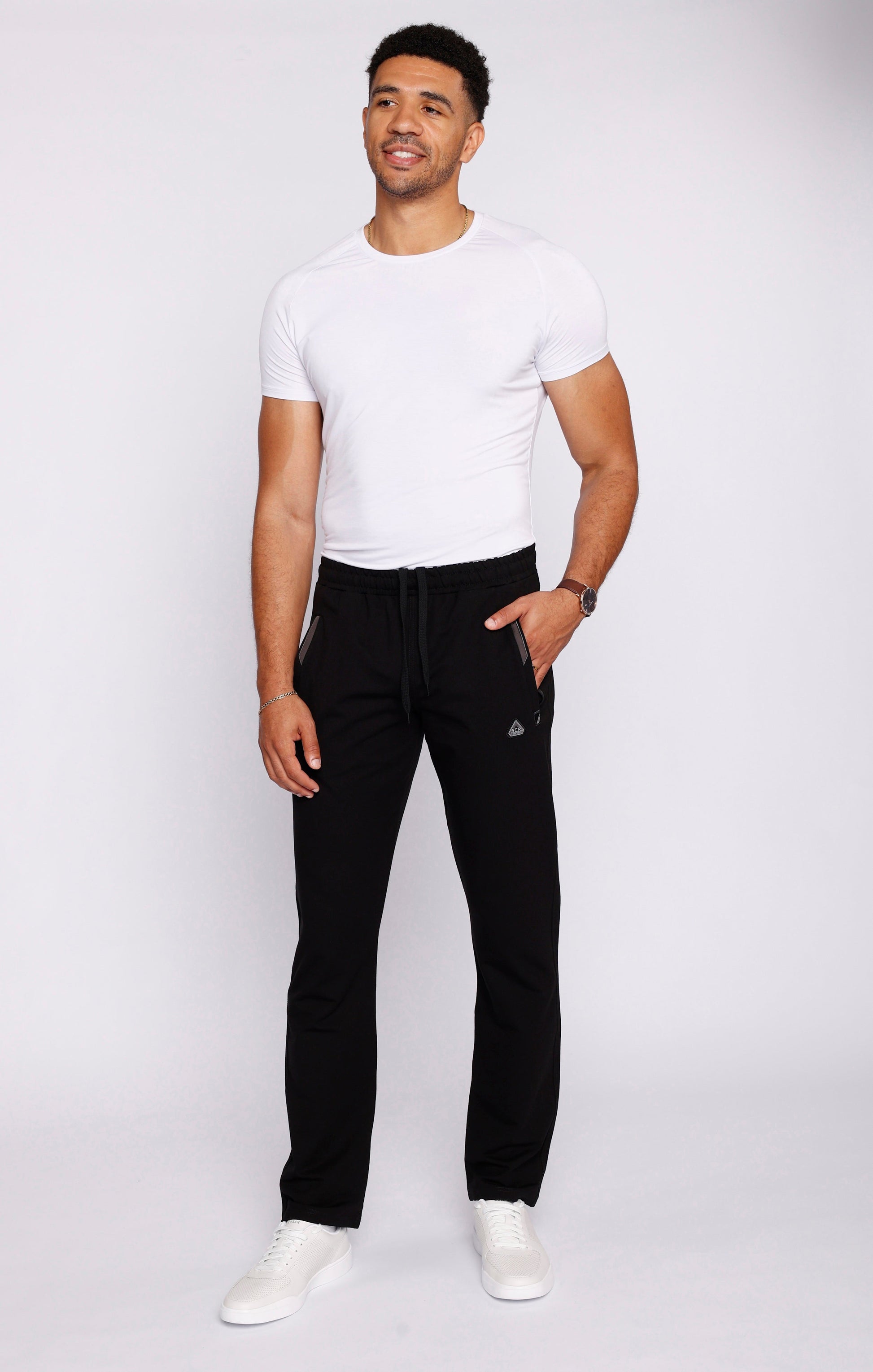 Black athletic straight sweatpants with drawstring waistband and cuffed ankle