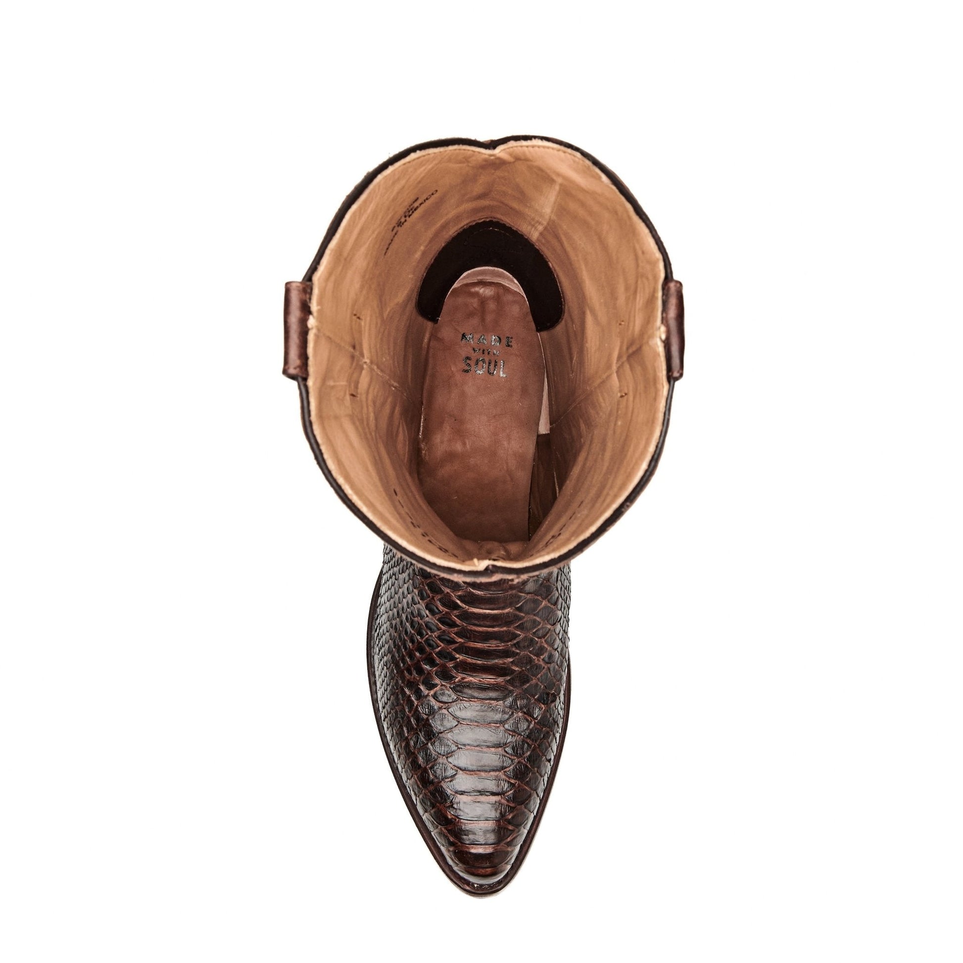 Brown leather cowboy boot interior view with tan lining and oval opening