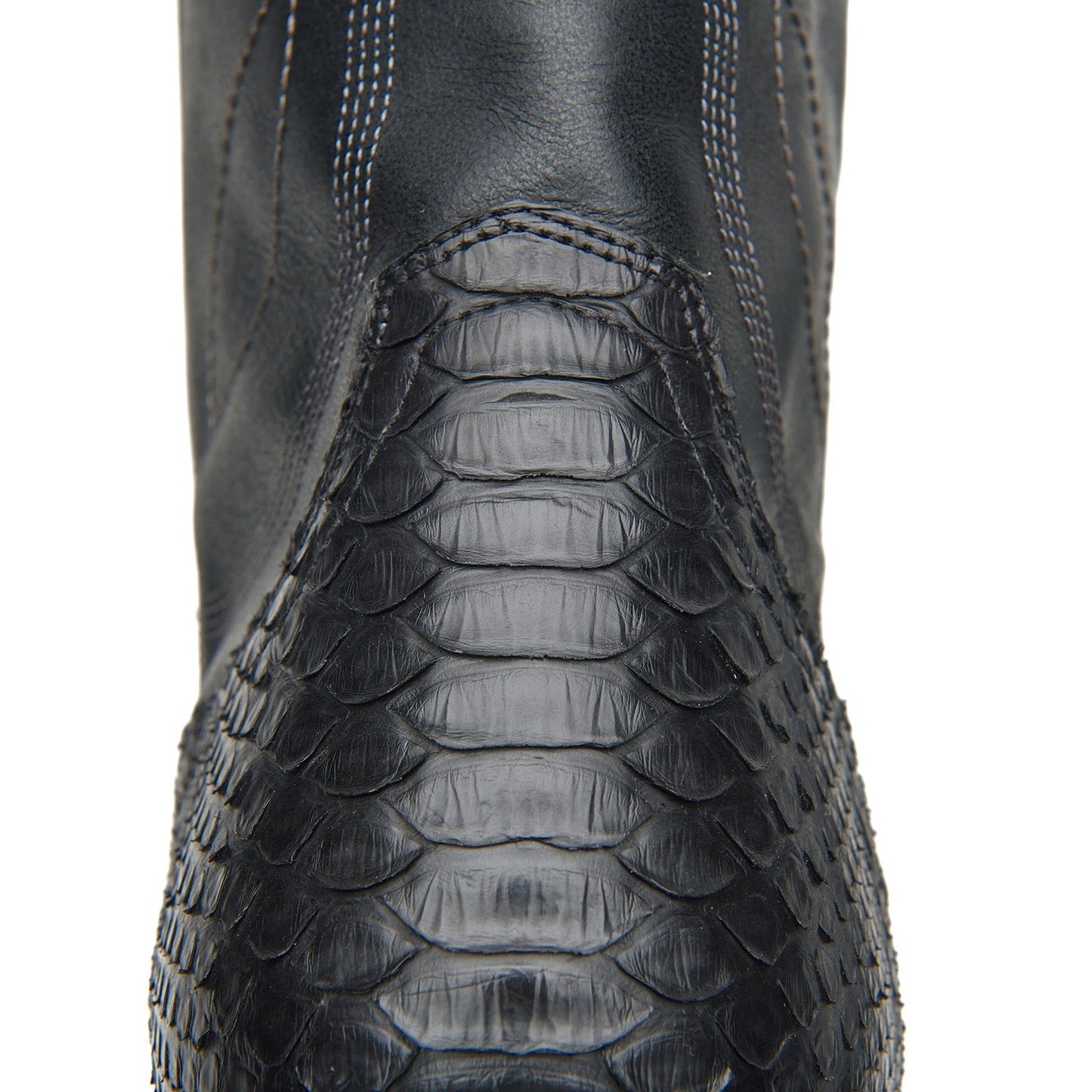 Black cowboy boot shaft with crocodile-style texture and stitched panel detail