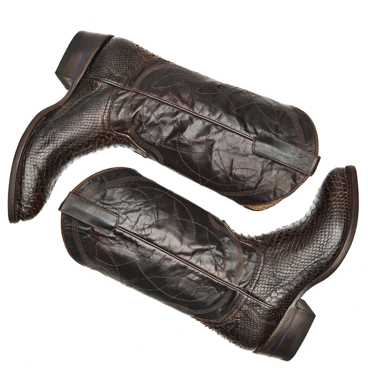 Brown leather cowboy boots with pointed toes, pull loops, and quilted side panels