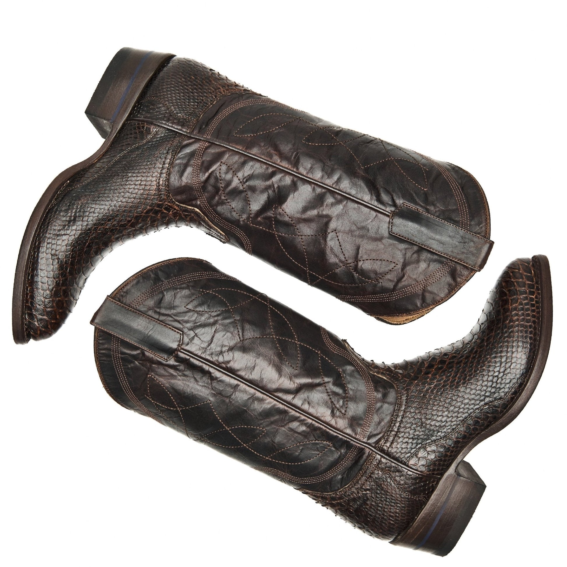 Brown leather cowboy boots with pointed toes, pull loops, and quilted side panels
