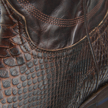 Brown leather cowboy boot upper with scale pattern, stitching, and pull tab detail