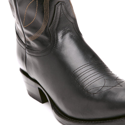 Black cowboy boot with cowboy-style stitched panels and low block heel