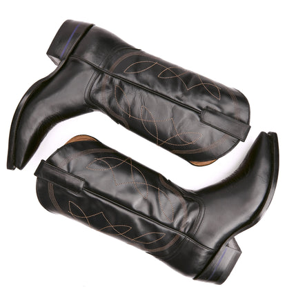 Pair of black pull-on cowboy boots with western swirl stitching and side straps