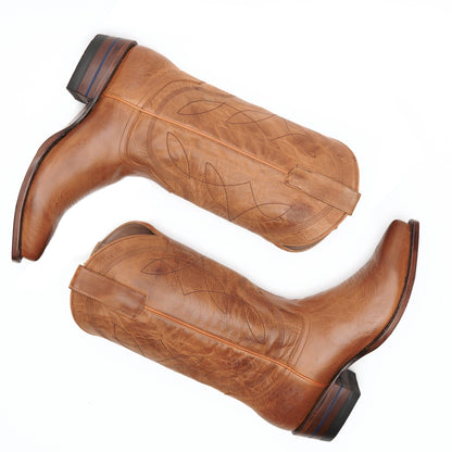 Honey brown leather cowboy boots with stitched vamps and low stacked heel.