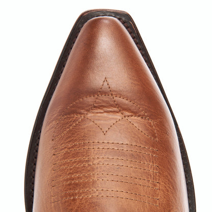 Brown boot toe with visible topstitching and leather grain close-up