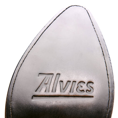 Black boot toe with embossed logo and contrast stitching at the seam