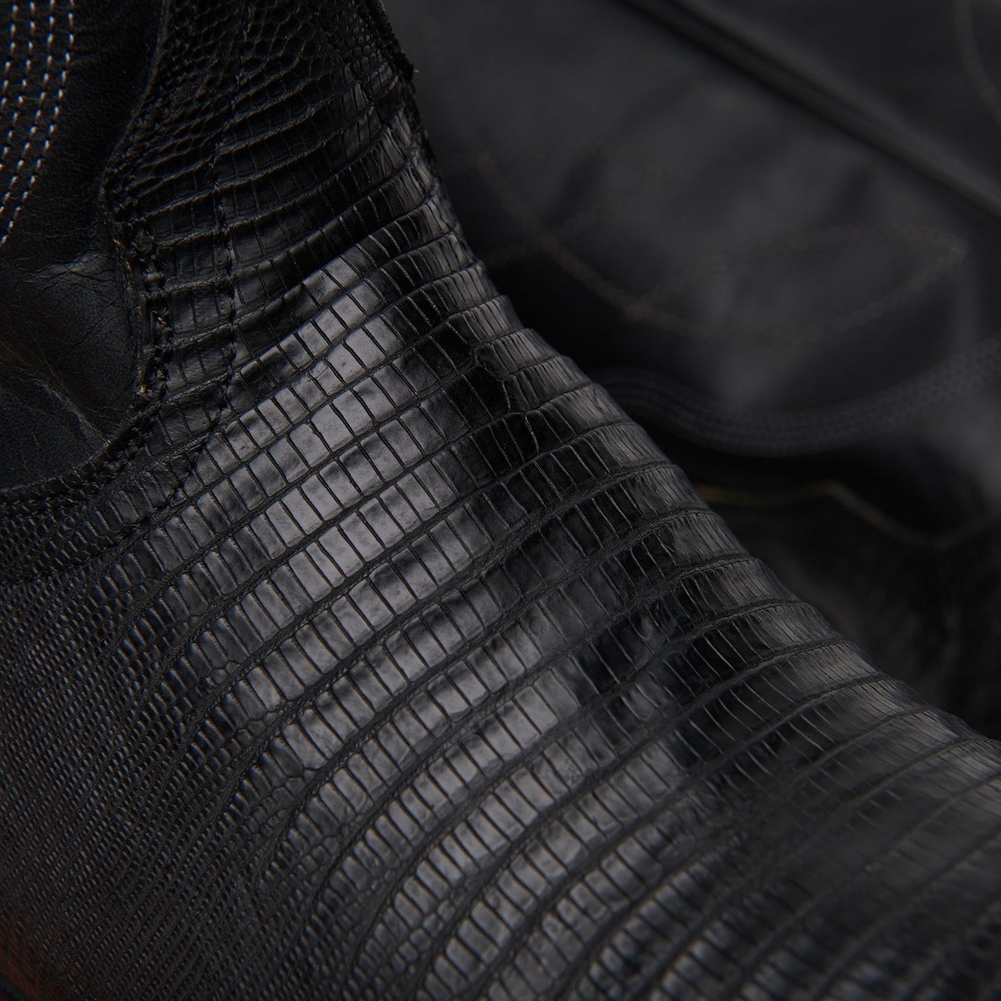 Black embossed leather boot upper with textured crocodile-like pattern