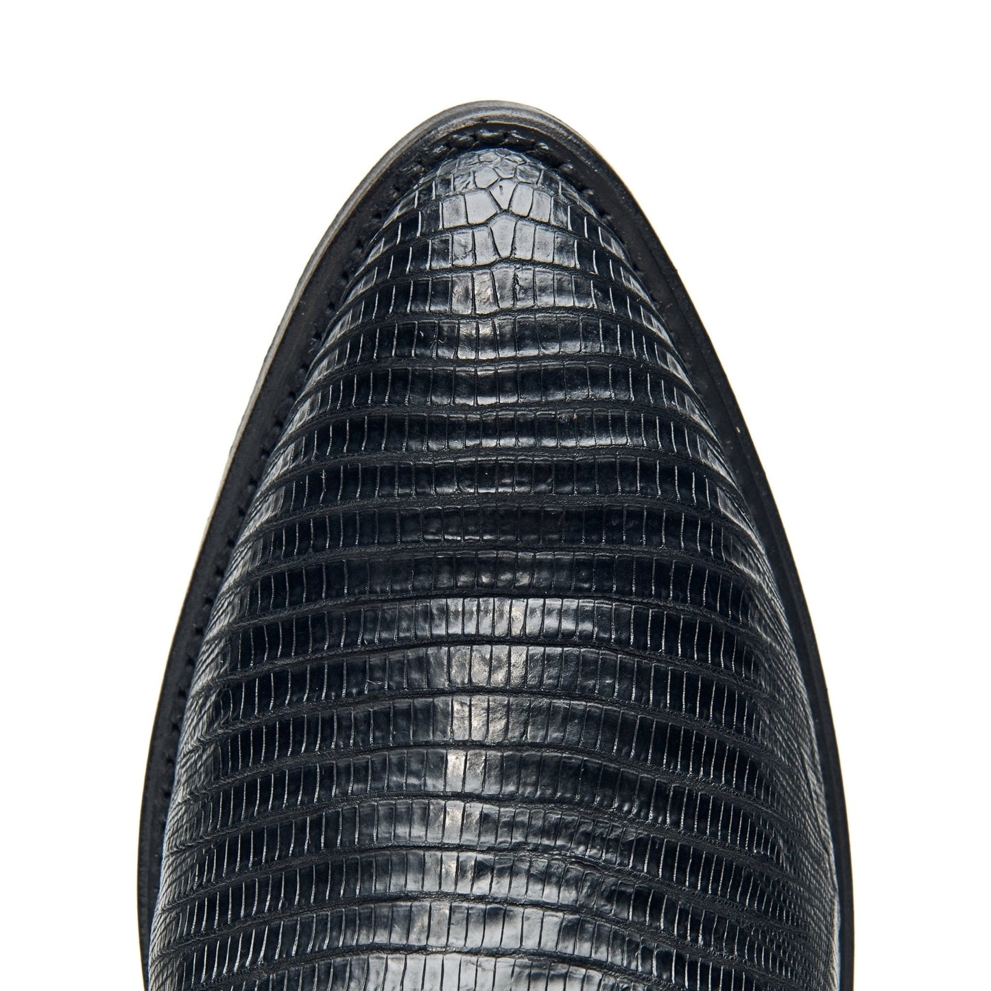 Black cowboy boot toe with alligator-style texture and smooth rounded edge.