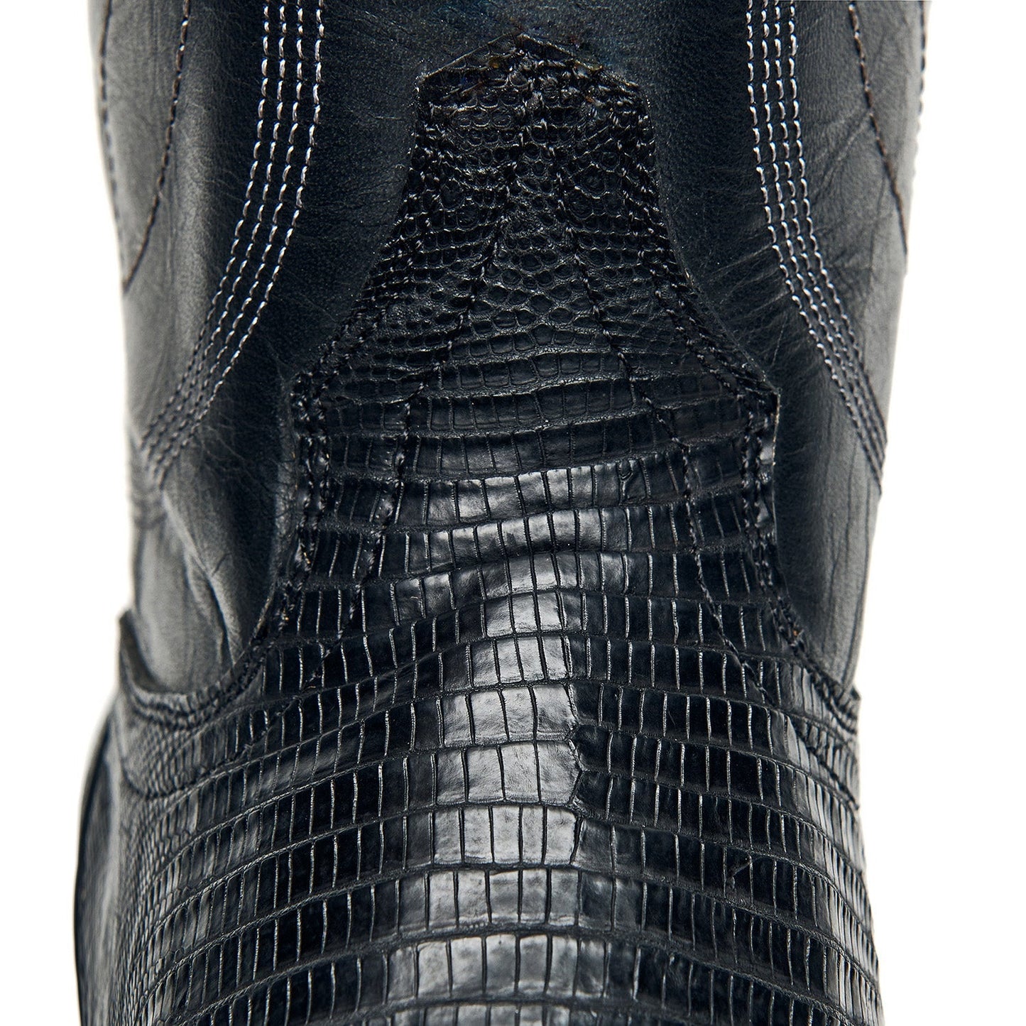 Black cowboy boot shaft with crocodile-style texture and stitched seam lines.