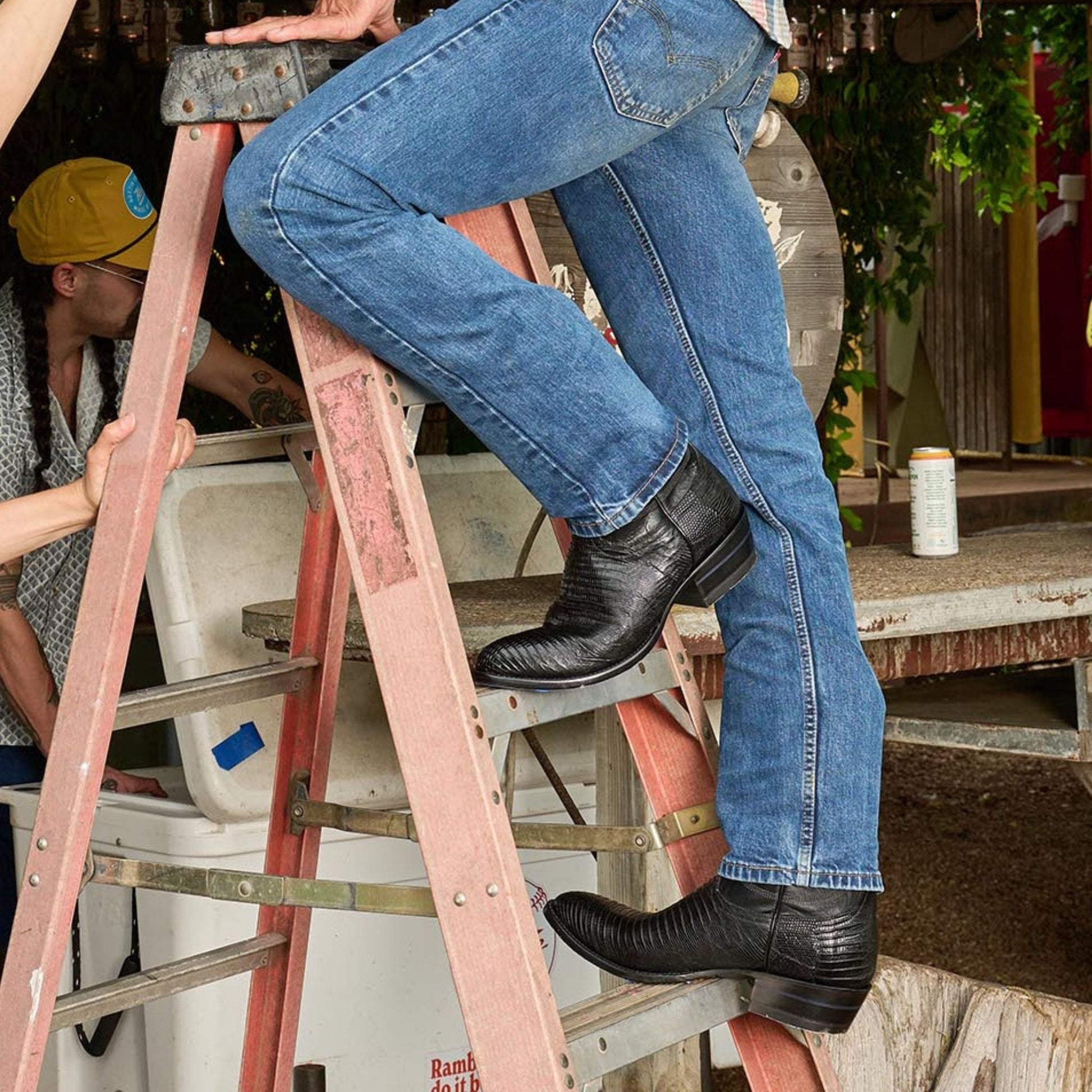 Black cowboy boots with pointed toes and stacked heels