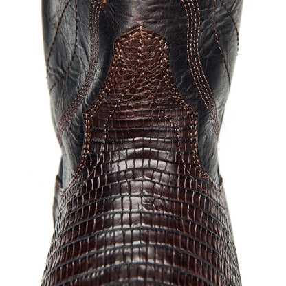 Dark brown cowboy boot toe with textured leather and curved stitch lines