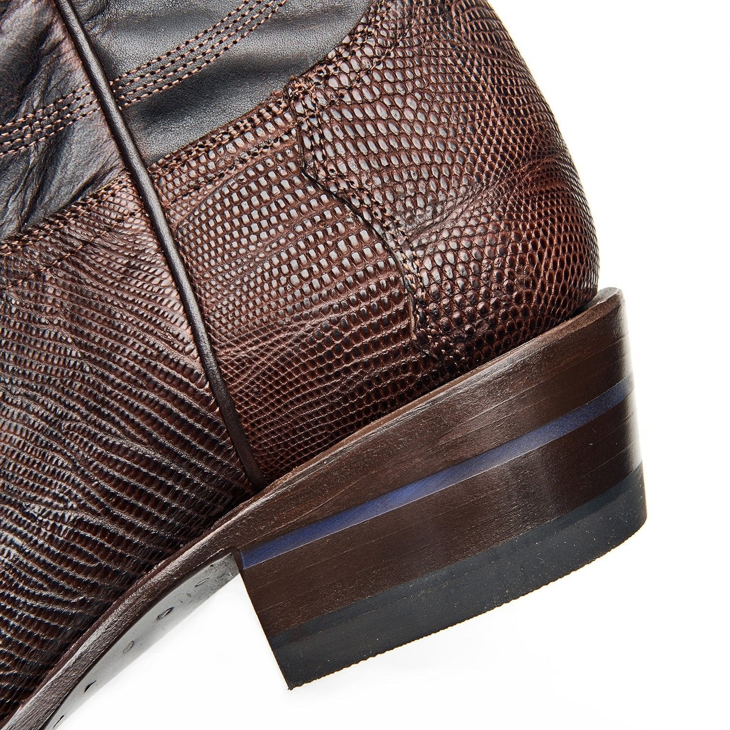 The Congress boot heel and side in dark brown textured leather with rubber sole edge