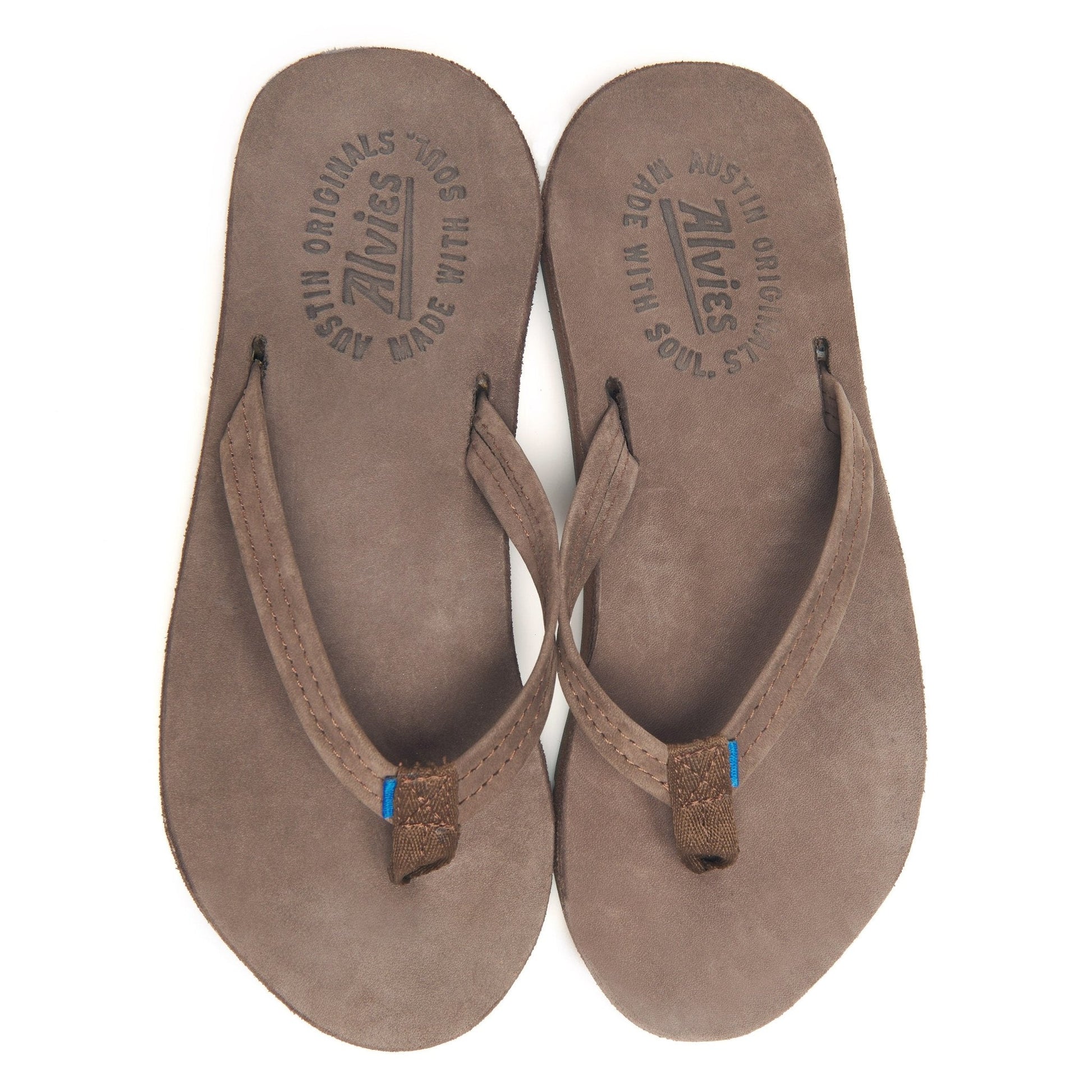 Brown suede flip-flops showing printed insoles with blue toe posts