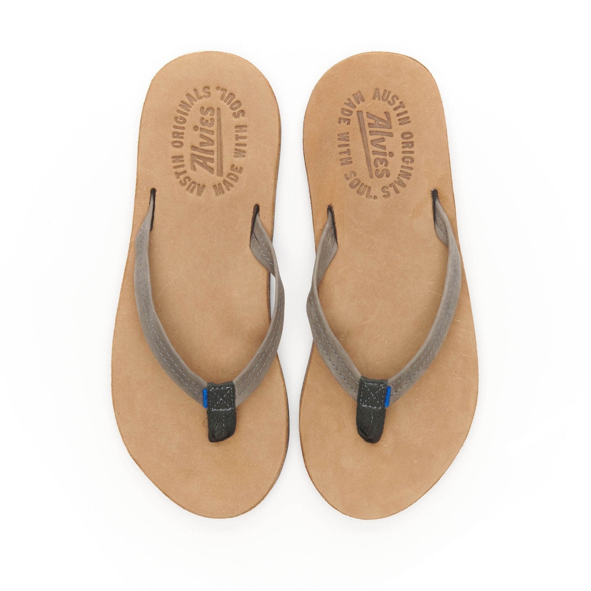 Pair of gray flip-flops with blue-tipped thong straps and tan insoles