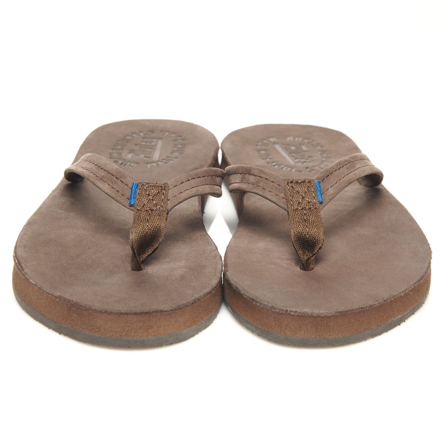 Pair of brown suede flip-flops with blue-accented thong straps and stitched edge
