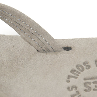 Thong strap with stitch detail; tan footbed with Austin logo.
